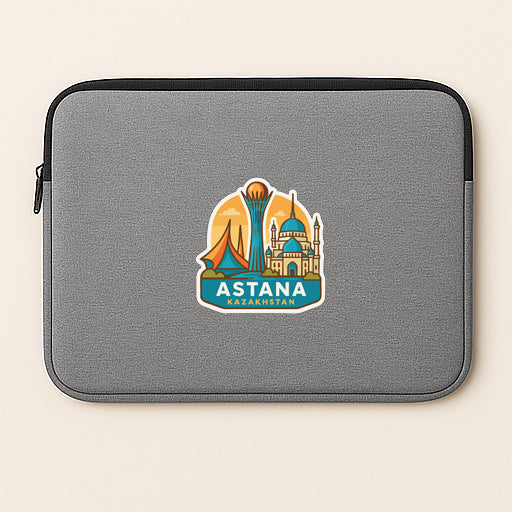 a gray laptop sleeve with a sticker of Astan, the capital of Afghanistan, on it.