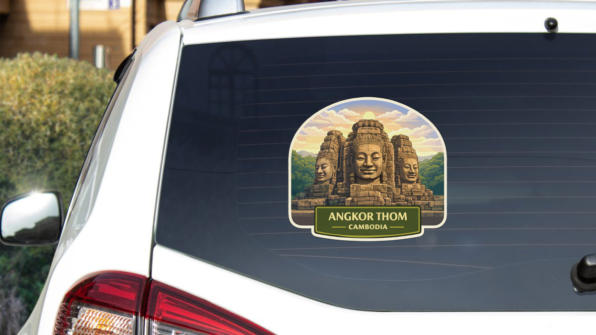 a sticker on the rear window of a car that displays the image of the Angkor Thom temple complex in Cambodia.