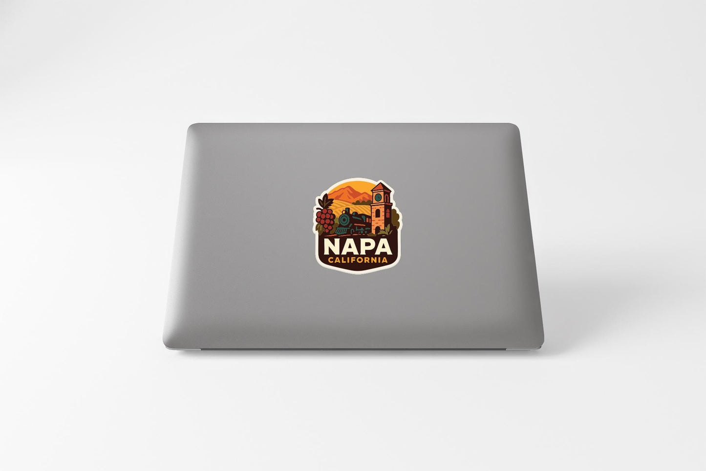 a sticker with a graphic of a building and mountains, along with the text "NAPA CALIFORNIA" printed on it.
