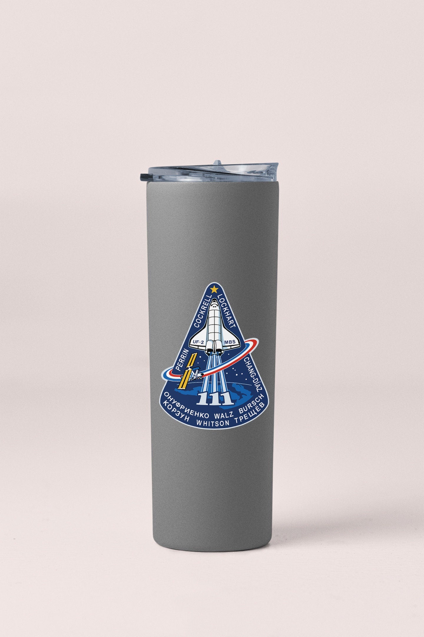 a stainless steel travel mug with a nasa emblem