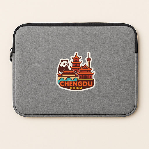 A gray laptop sleeve with a sticker depicting a panda bear and a traditional Chinese temple.