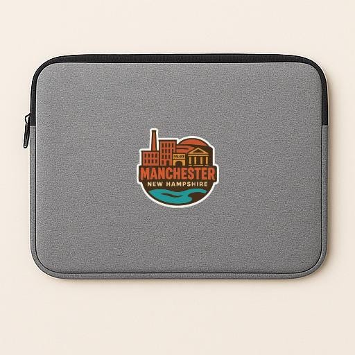 A gray laptop sleeve with a circular logo that says "MANCHESTER NEW HAMPSHIRE".