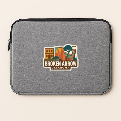 A gray laptop sleeve with a logo for Broken Arrow, Oklahoma.
