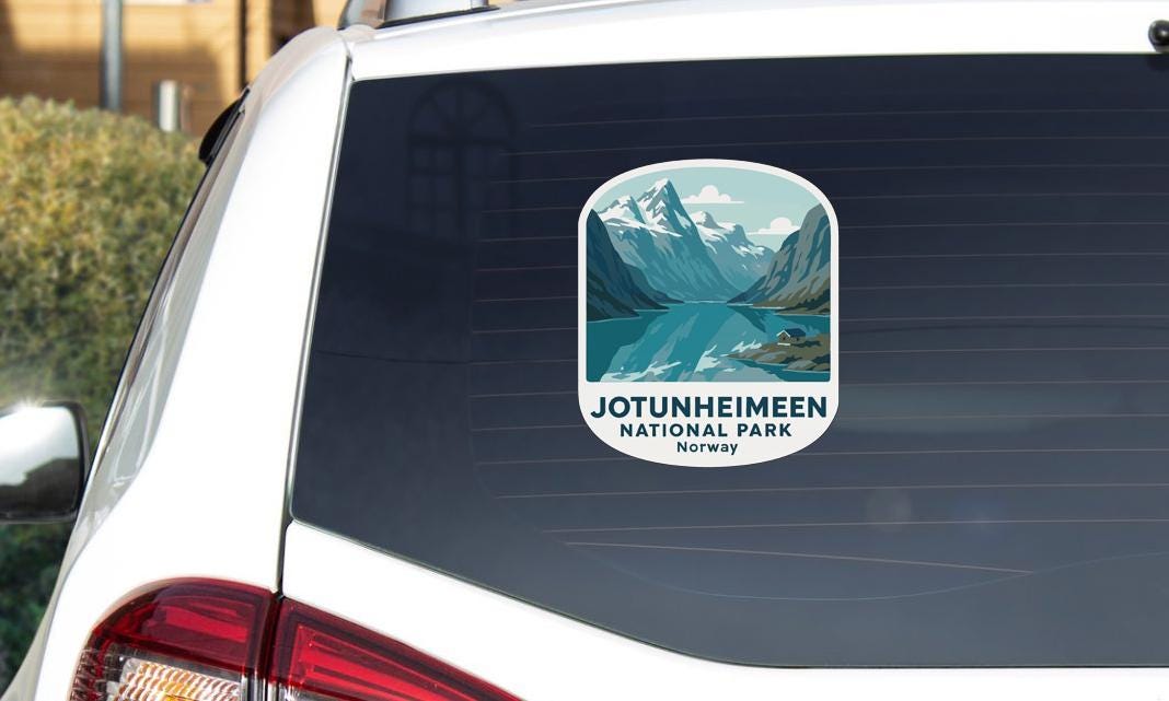 A sticker on the rear window of a car that says "Jotunheimen NATIONAL PARK NORWAY".
