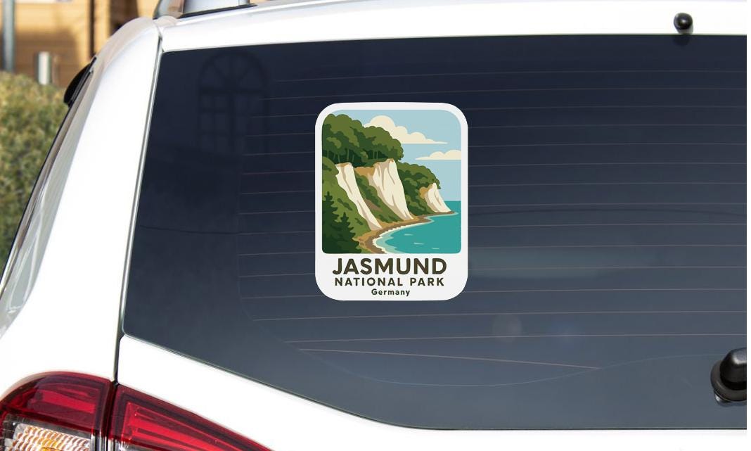 A sticker on the rear window of a car that says "JASMUND NATIONAL PARK GERMANY".