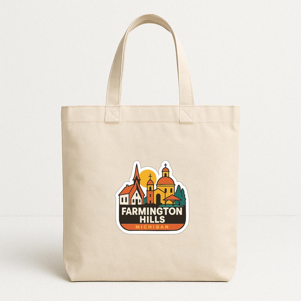 A beige tote bag with a sticker depicting a cityscape and the text "FARMINGTON HILLS MICHIGAN" printed on it.
