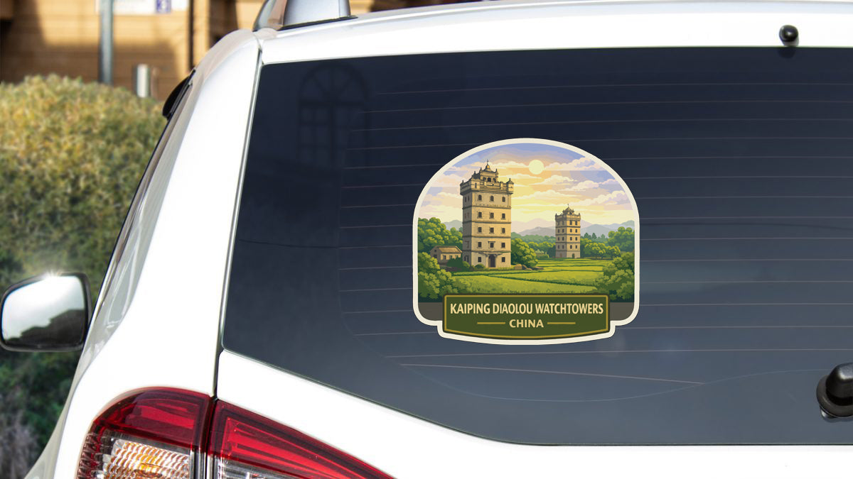 a sticker on the rear window of a car, depicting a scenic landscape with two towers in the background.