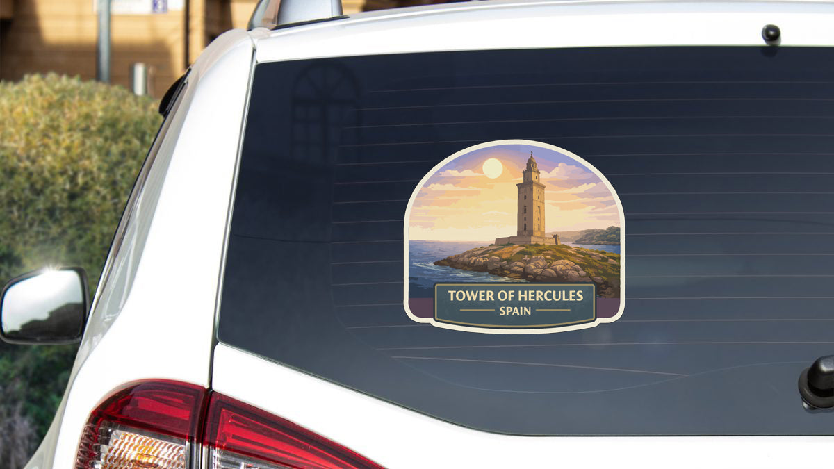 A sticker on the rear window of a car depicting the Tower of Hercules in Spain.