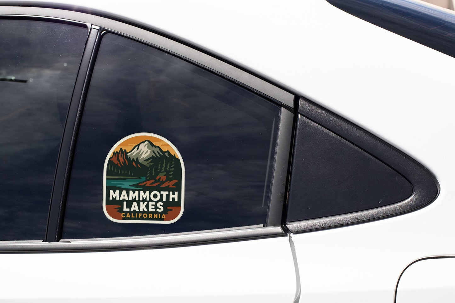 A car window with a sticker that says "Mammoth Lakes, California".