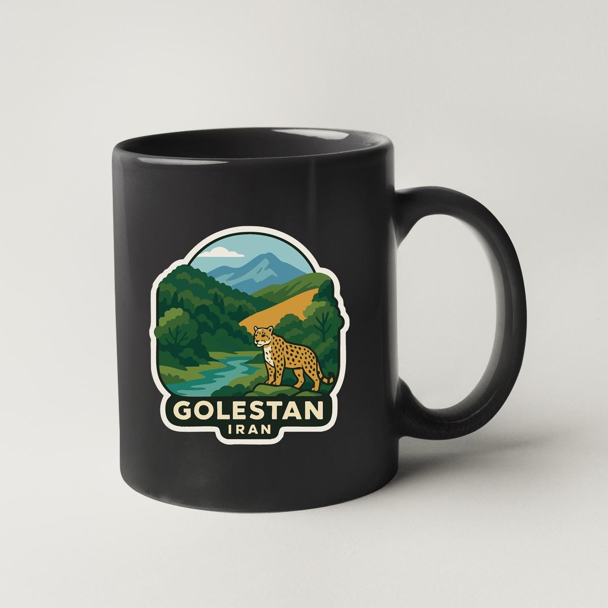 A black coffee mug with a graphic design depicting a cheetah in a natural landscape, along with the text "GOLESTAN IRAN".