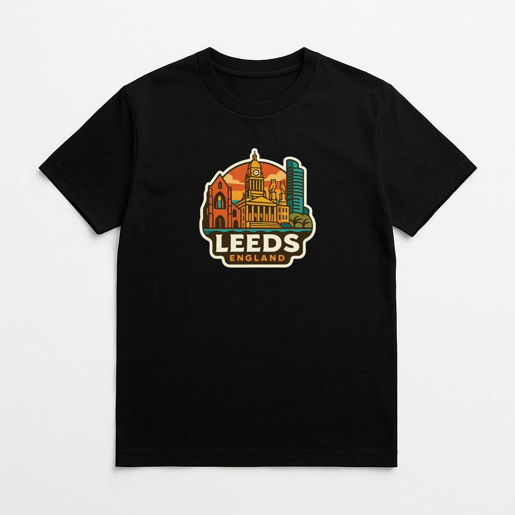 A black t-shirt with a colorful graphic design depicting the skyline of Leeds, England.