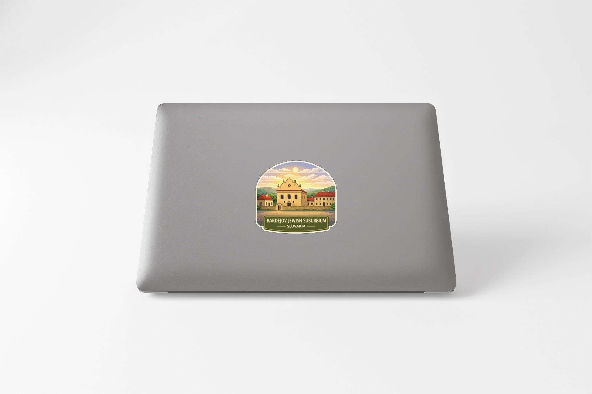 A sticker depicting a building with a colorful background and a sunset in the distance.