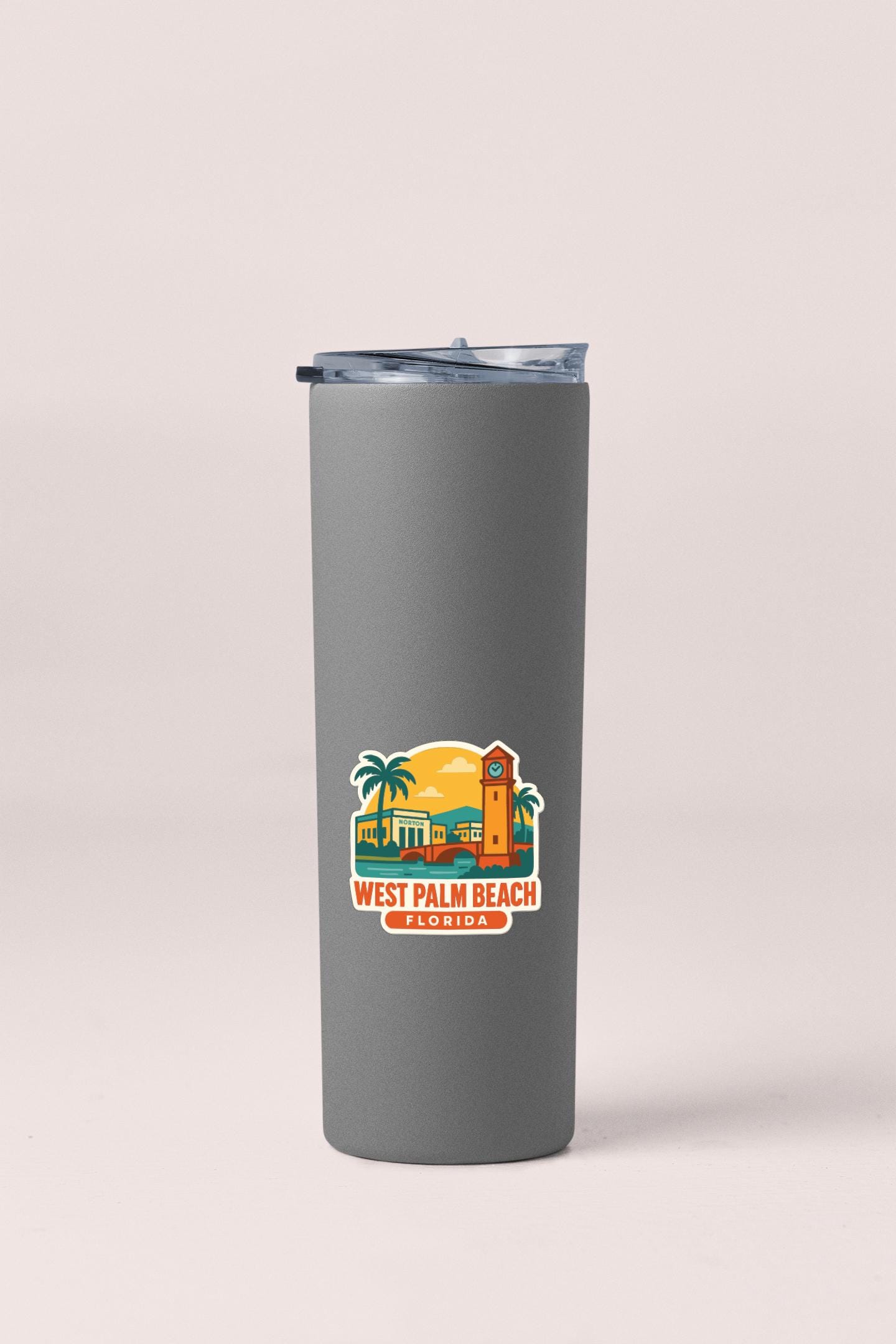 A gray insulated tumbler with a printed label that says "West Palm Beach Florida".