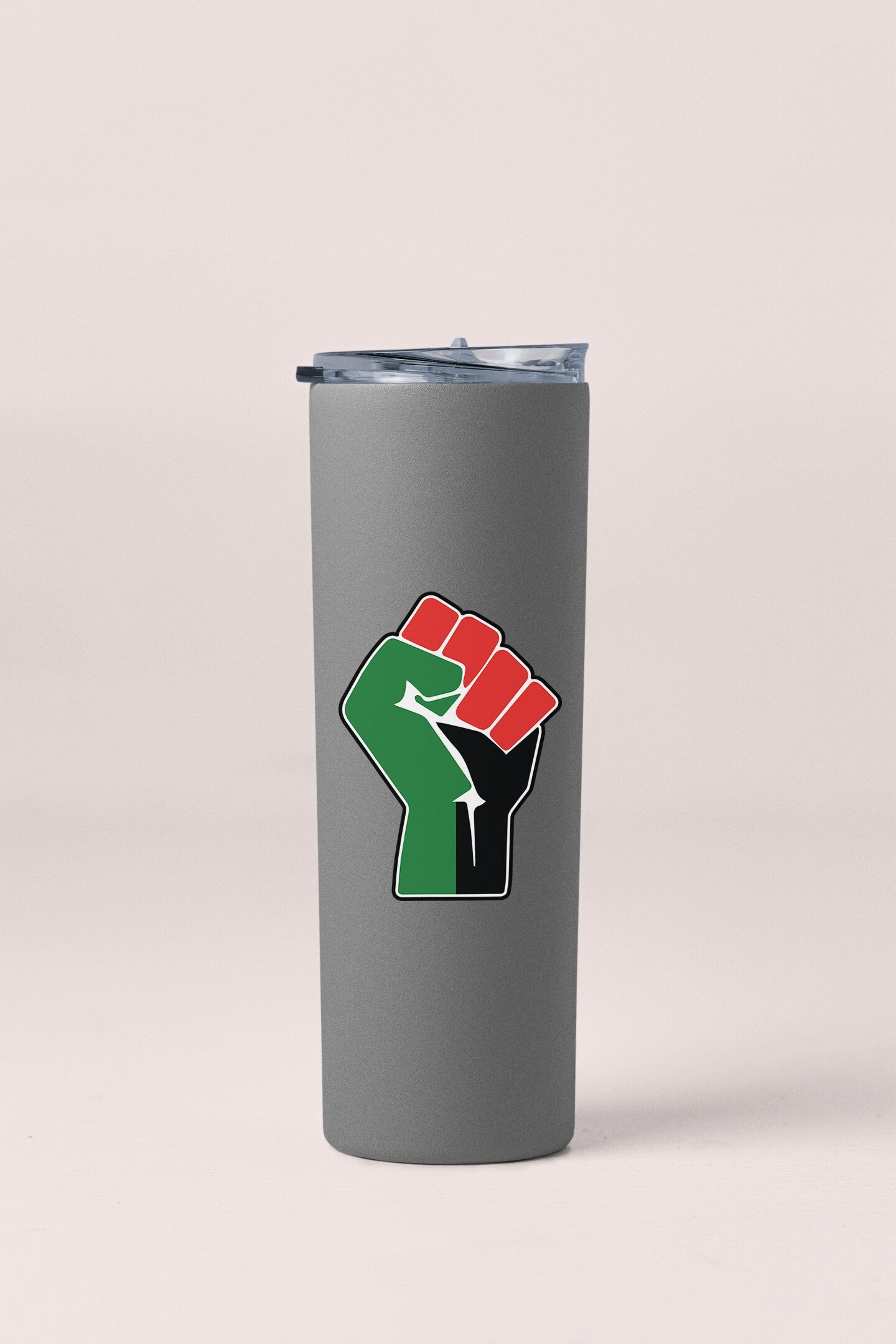 a gray tumbler cup with a red and green fist on it