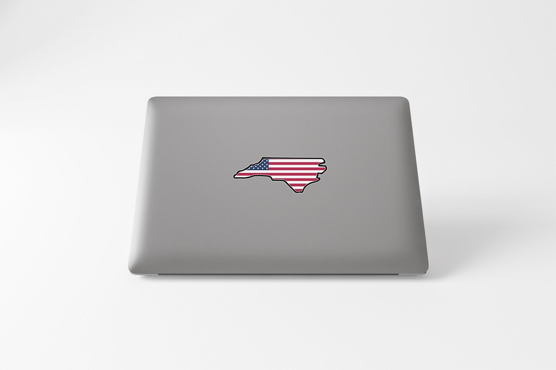 a laptop computer with a sticker of a map of the united states