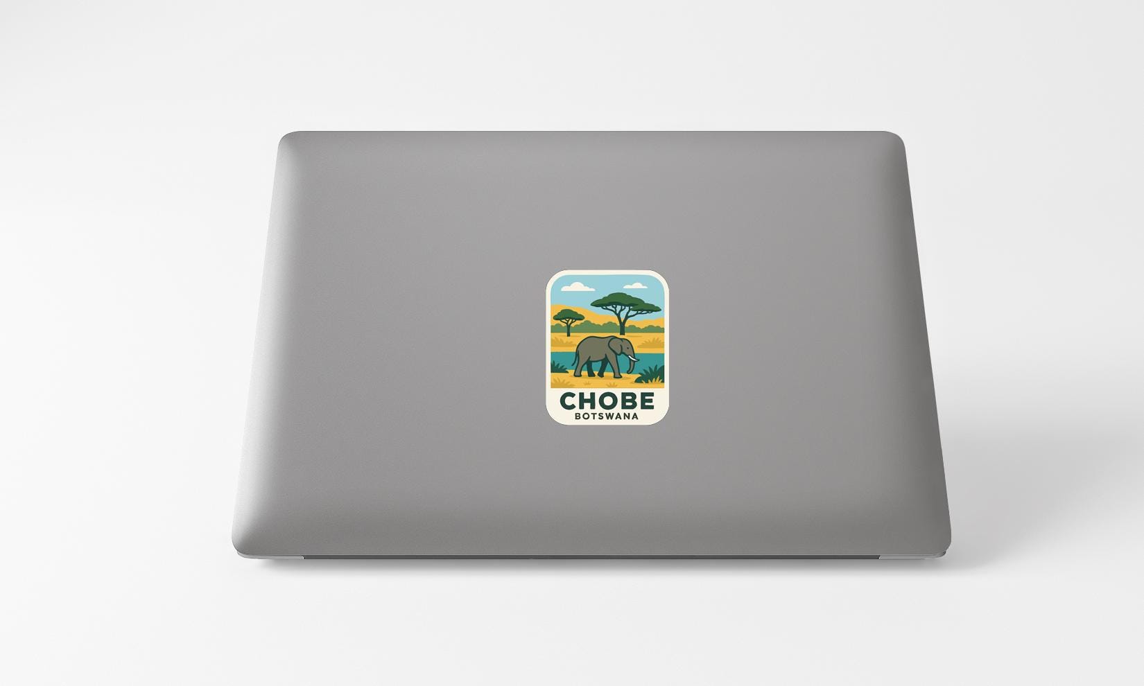a sticker with an elephant and a tree on a laptop.