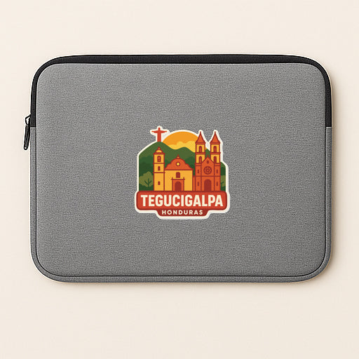 A gray laptop sleeve with a sticker depicting the city of Tecucigalpa, Honduras.