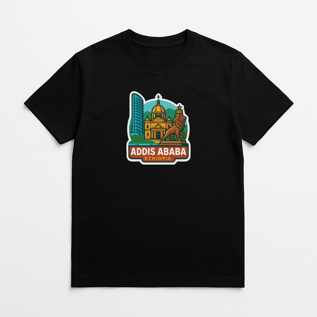 A black t-shirt with a graphic design featuring a city skyline, including a tall building and a lion, along with the text "ADDIS ABBA" and "ETHIOPIA".