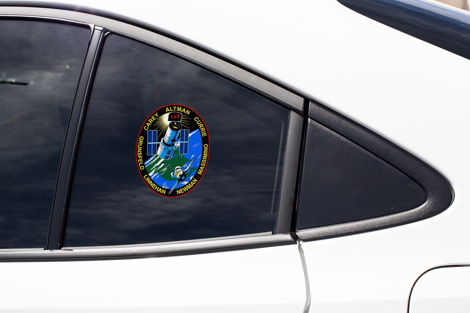 a close up of a car window with a sticker on it