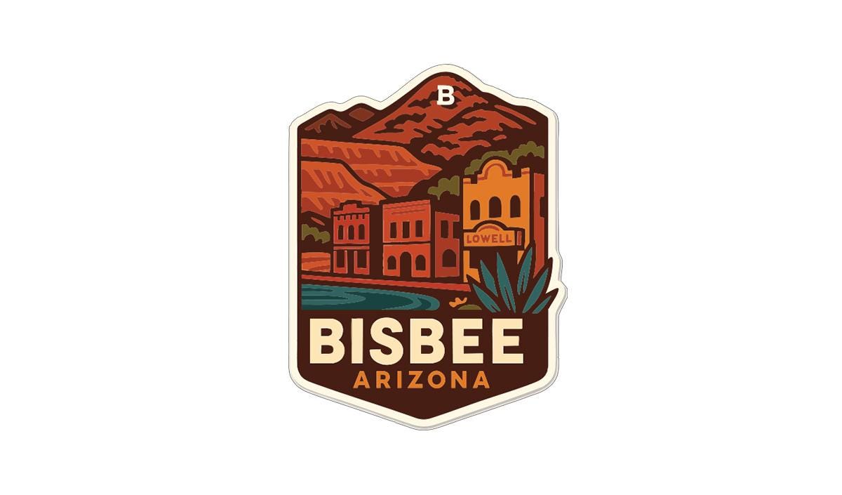 A sticker or emblem featuring a stylized illustration of a town or city with buildings, mountains, and a body of water, along with the text "BISBEE ARIZONA".