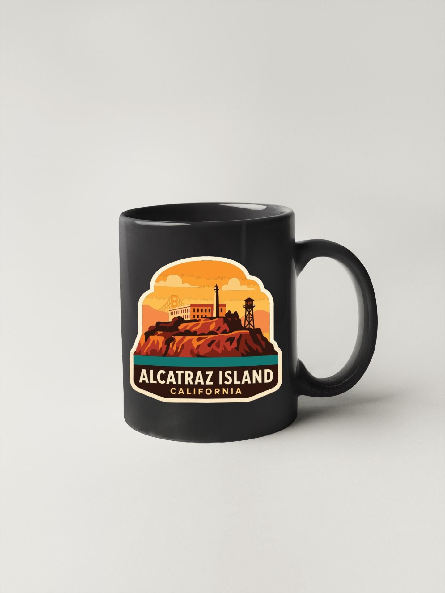 A black coffee mug with a graphic design depicting the Alcatraz Island in California.