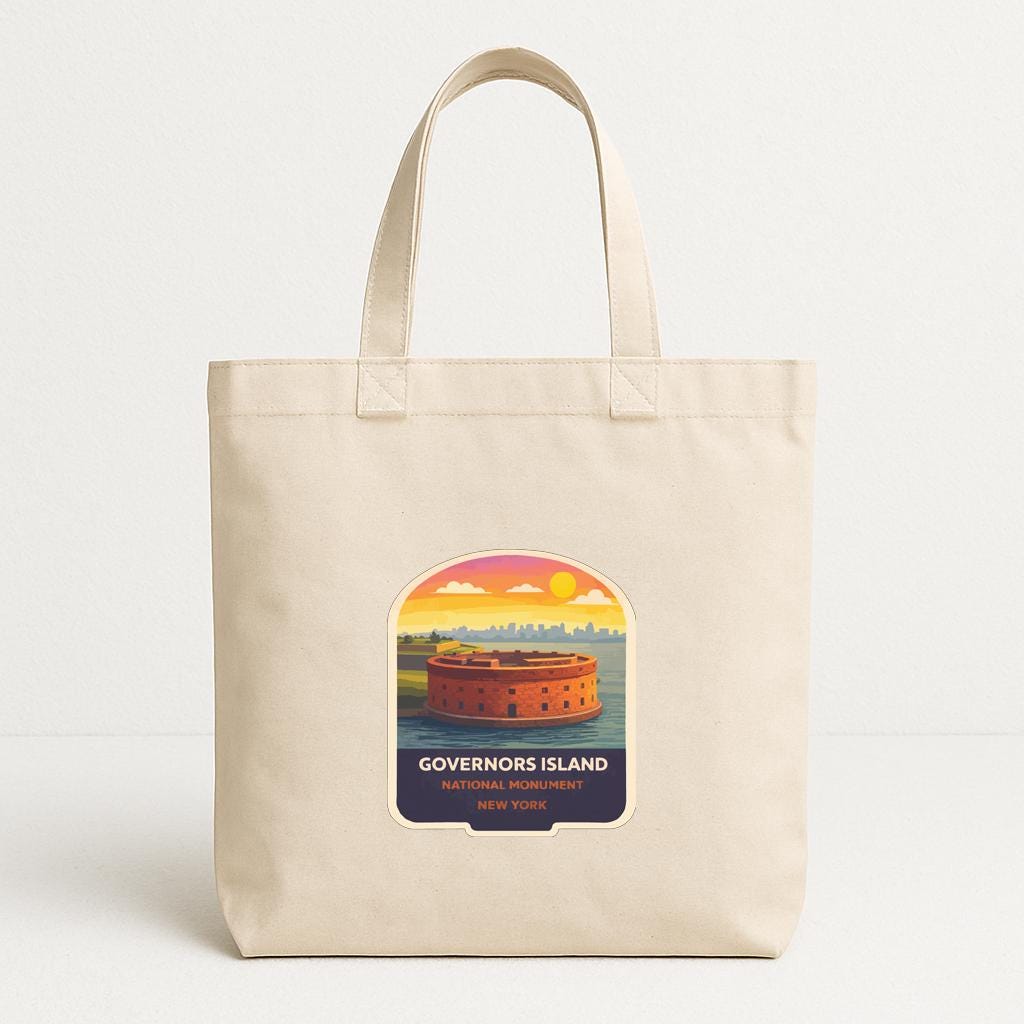 A beige tote bag with a printed design depicting the Governor's Island in New York.