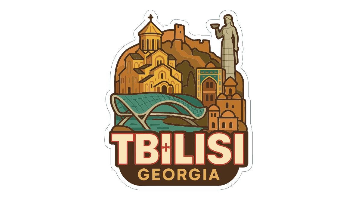 The image is a sticker or emblem featuring the city of Tbilisi, Georgia, with various landmarks and architectural elements depicted.