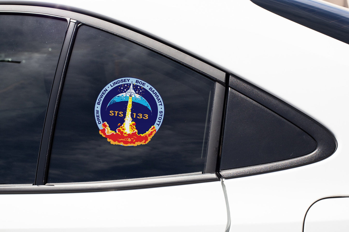 a close up of a car window with a sticker on it
