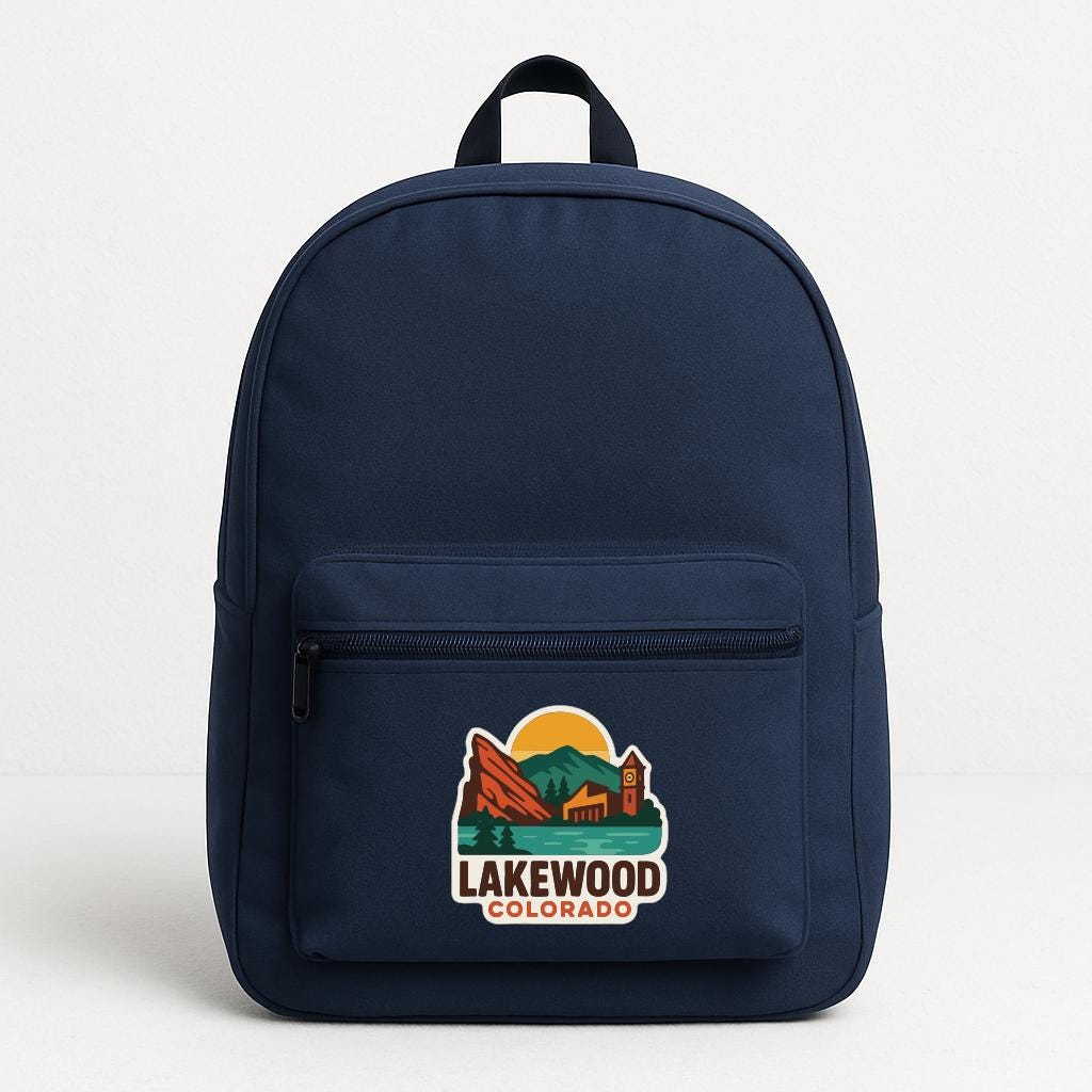 A navy blue backpack with a printed logo that says "LAKEWOOD COLORADO".