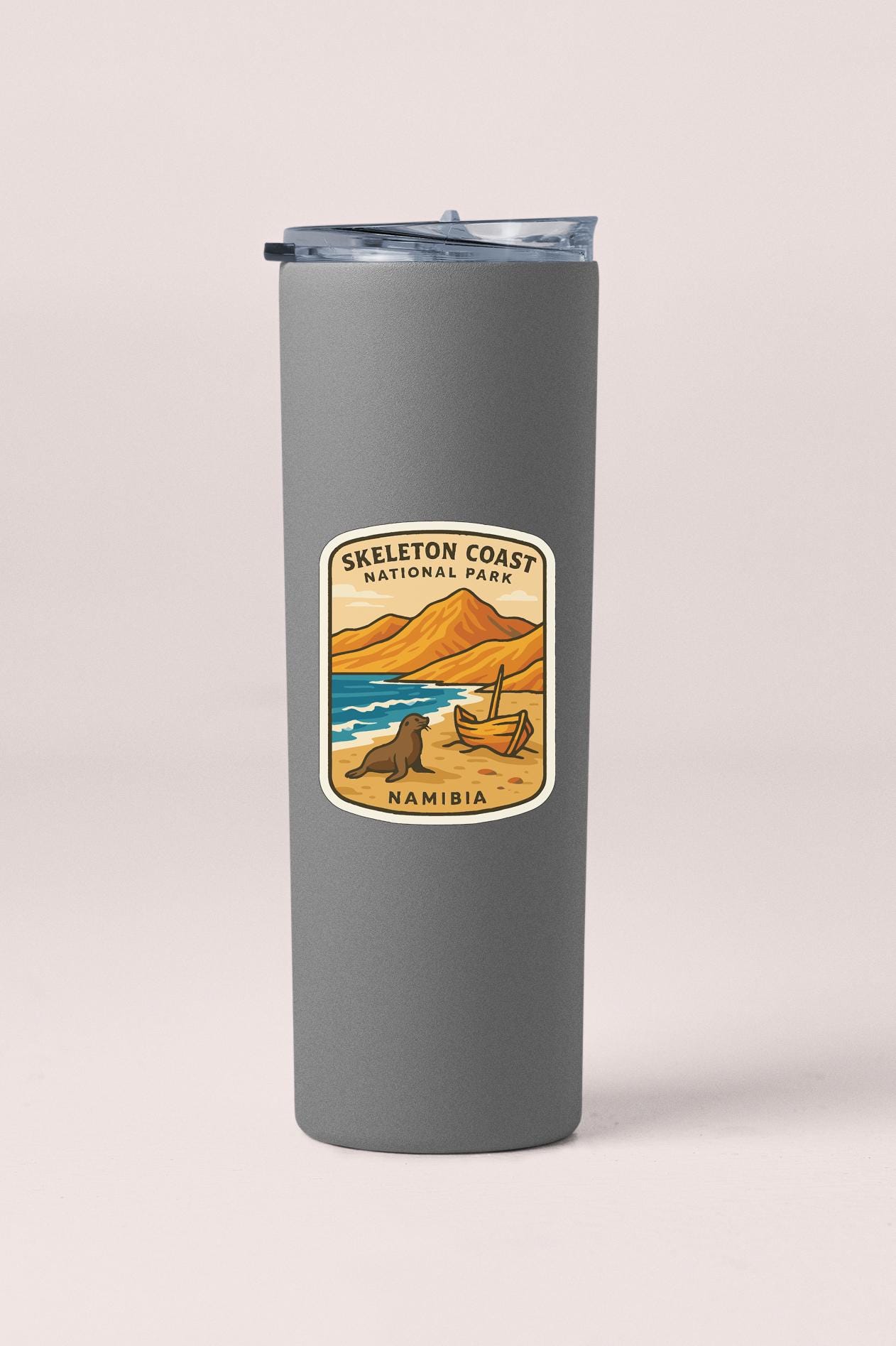 A gray insulated tumbler with a label that says "Skeleton Coast National Park Namibia".