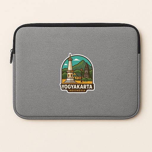 A gray laptop sleeve with a sticker depicting the Yogyakarta, Indonesia landmark.