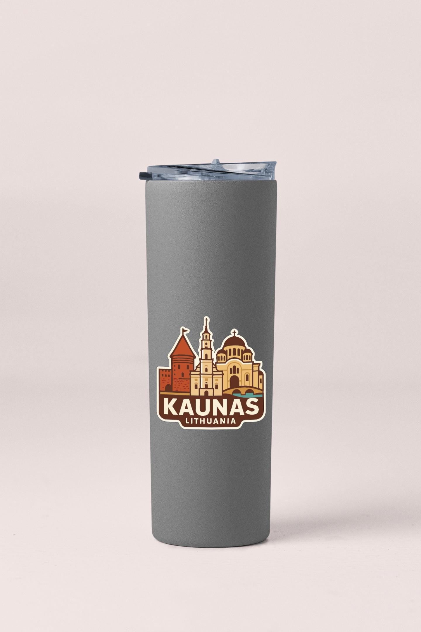 A gray tumbler with a printed logo depicting the city of Kaunas, Lithuania.