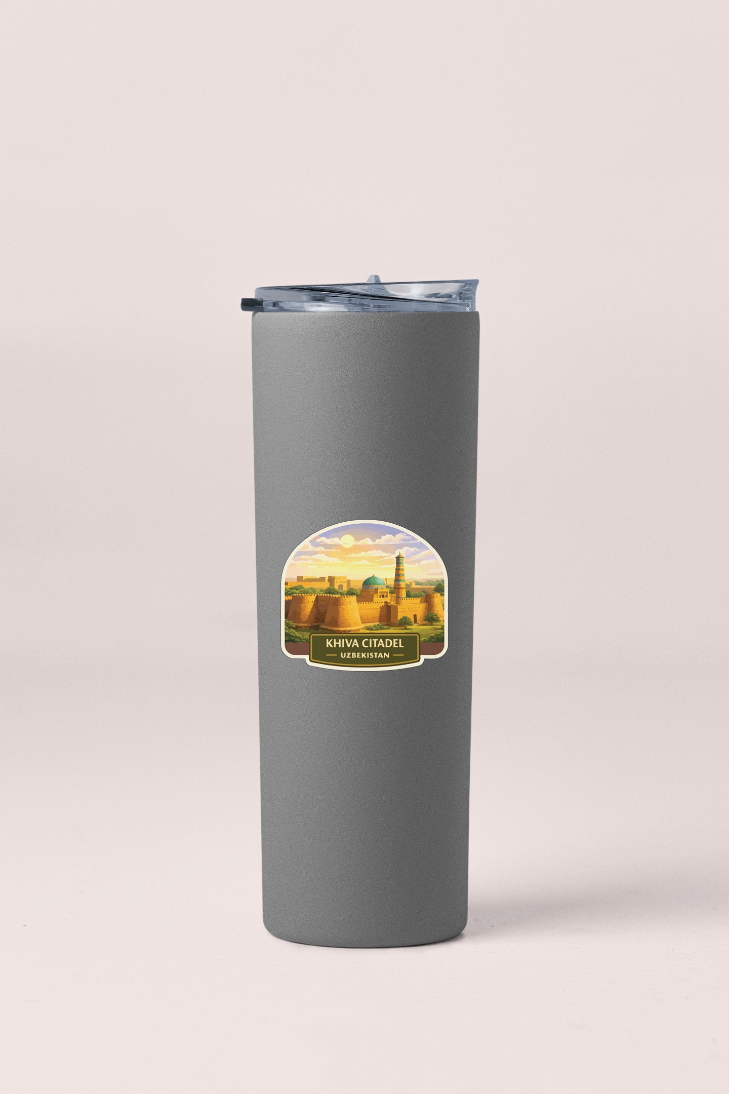 A gray cylindrical container with a lid and a label featuring a scenic image of a cityscape.