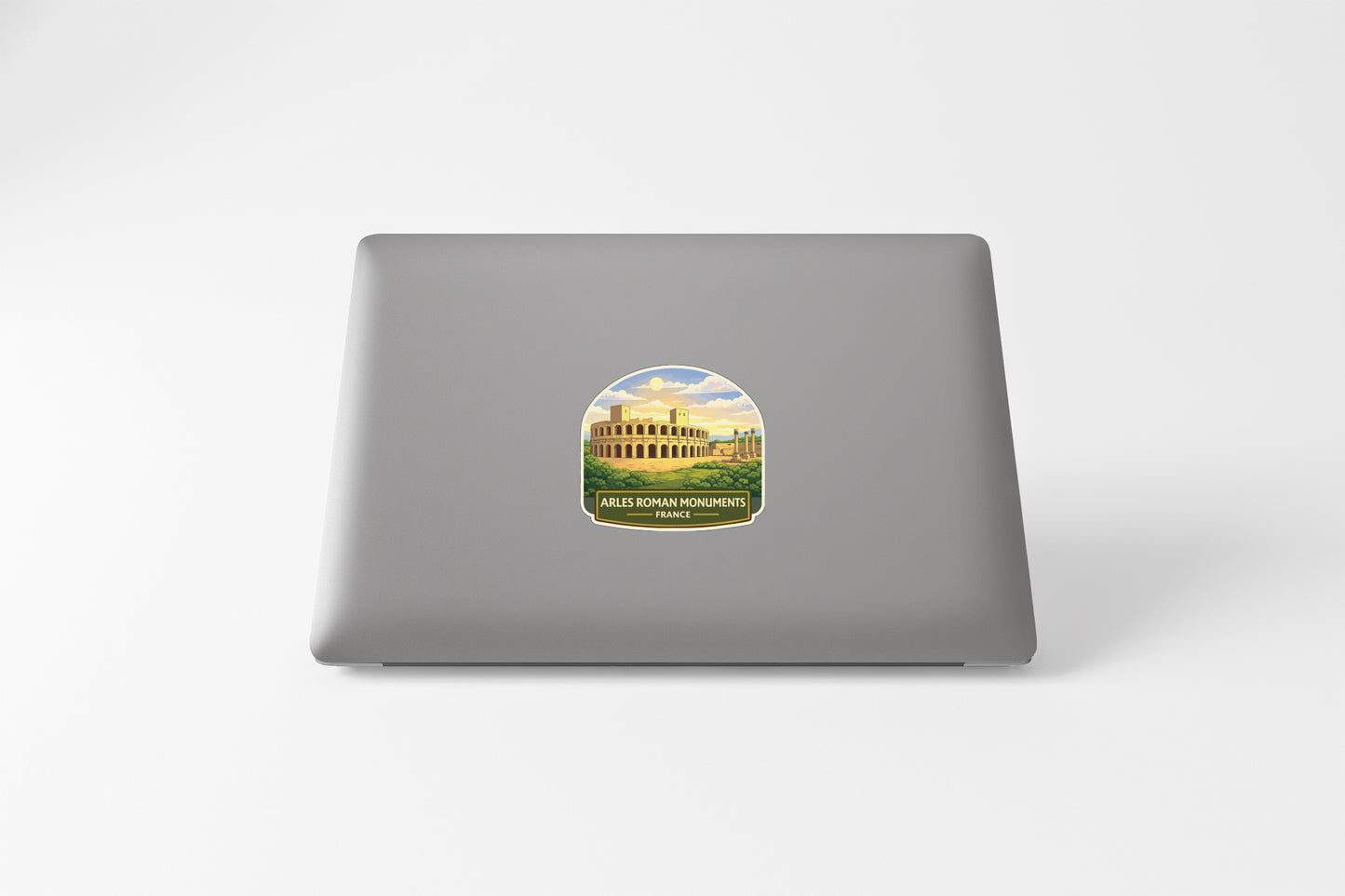 a sticker with a picture of a building, likely a historical monument, on the back of a laptop.