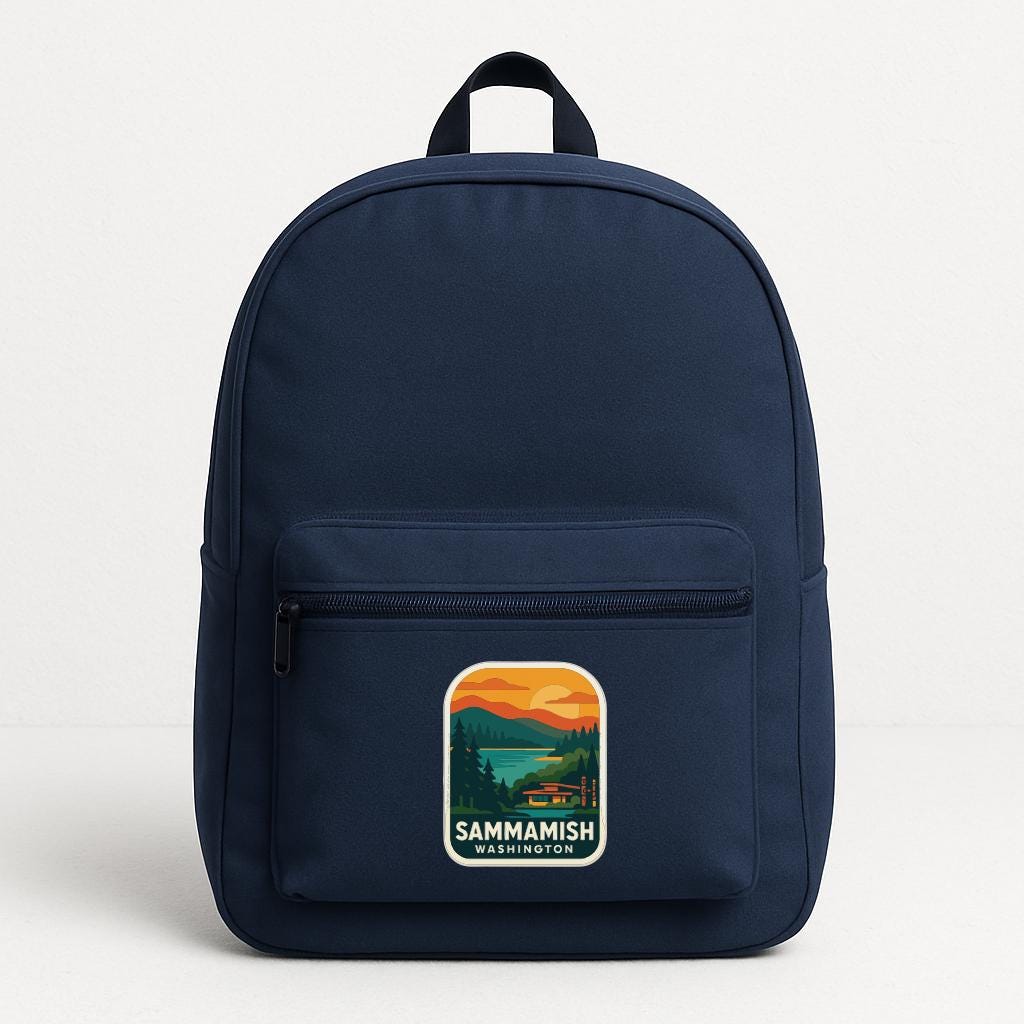 A navy blue backpack with a graphic patch on the front that says "SAMMAMISH WASHINGTON".
