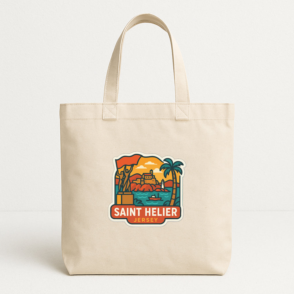 A beige tote bag with a colorful graphic depicting a beach scene and a castle, along with the text "SAINT HELIER JERSEY".