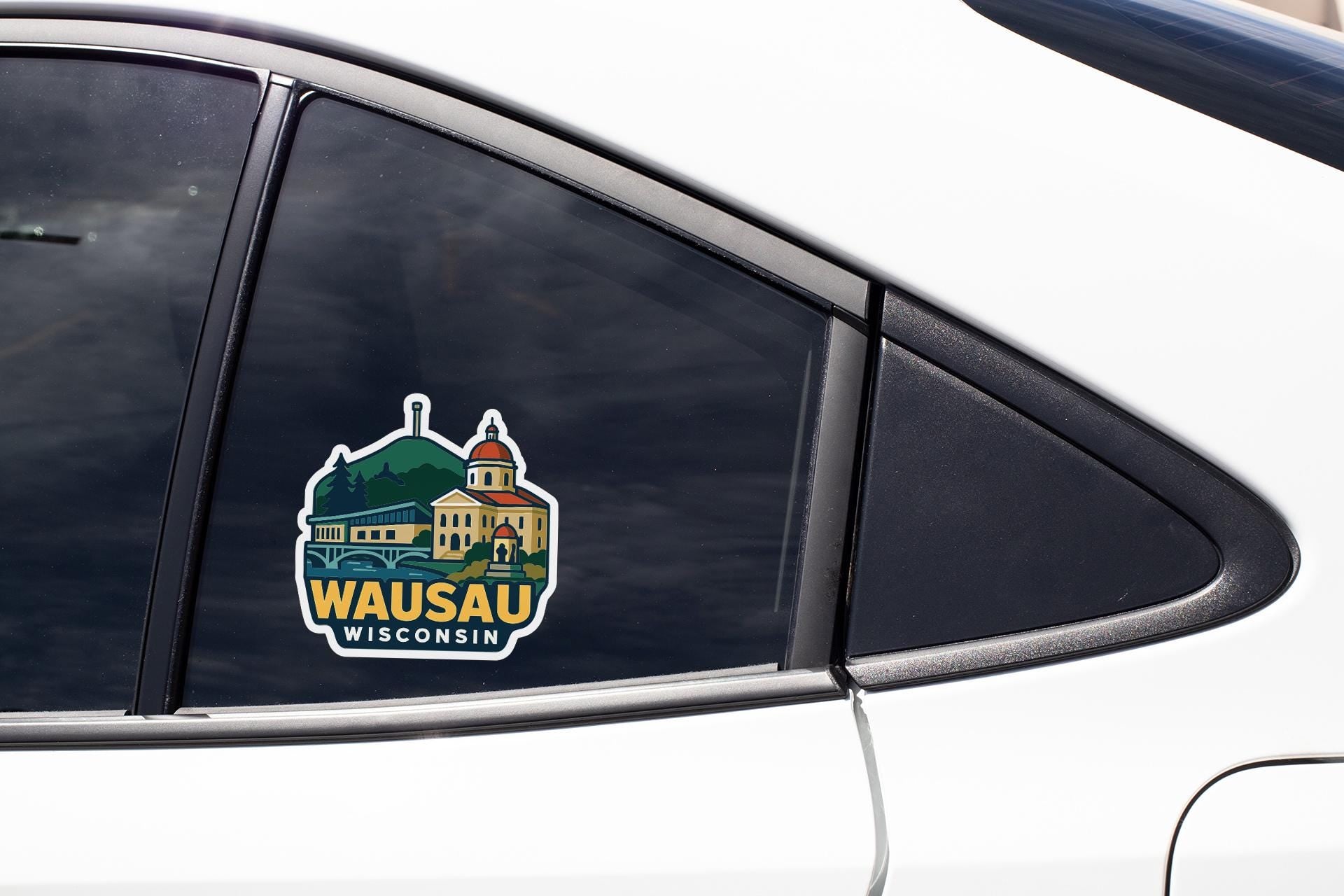 A sticker on the side of a car window that says "Wausau, Wisconsin".