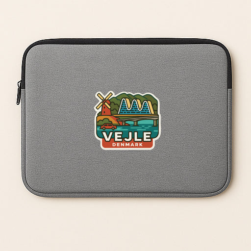 a gray laptop sleeve with a colorful sticker depicting a scenic landscape with a windmill, mountains, and a river.