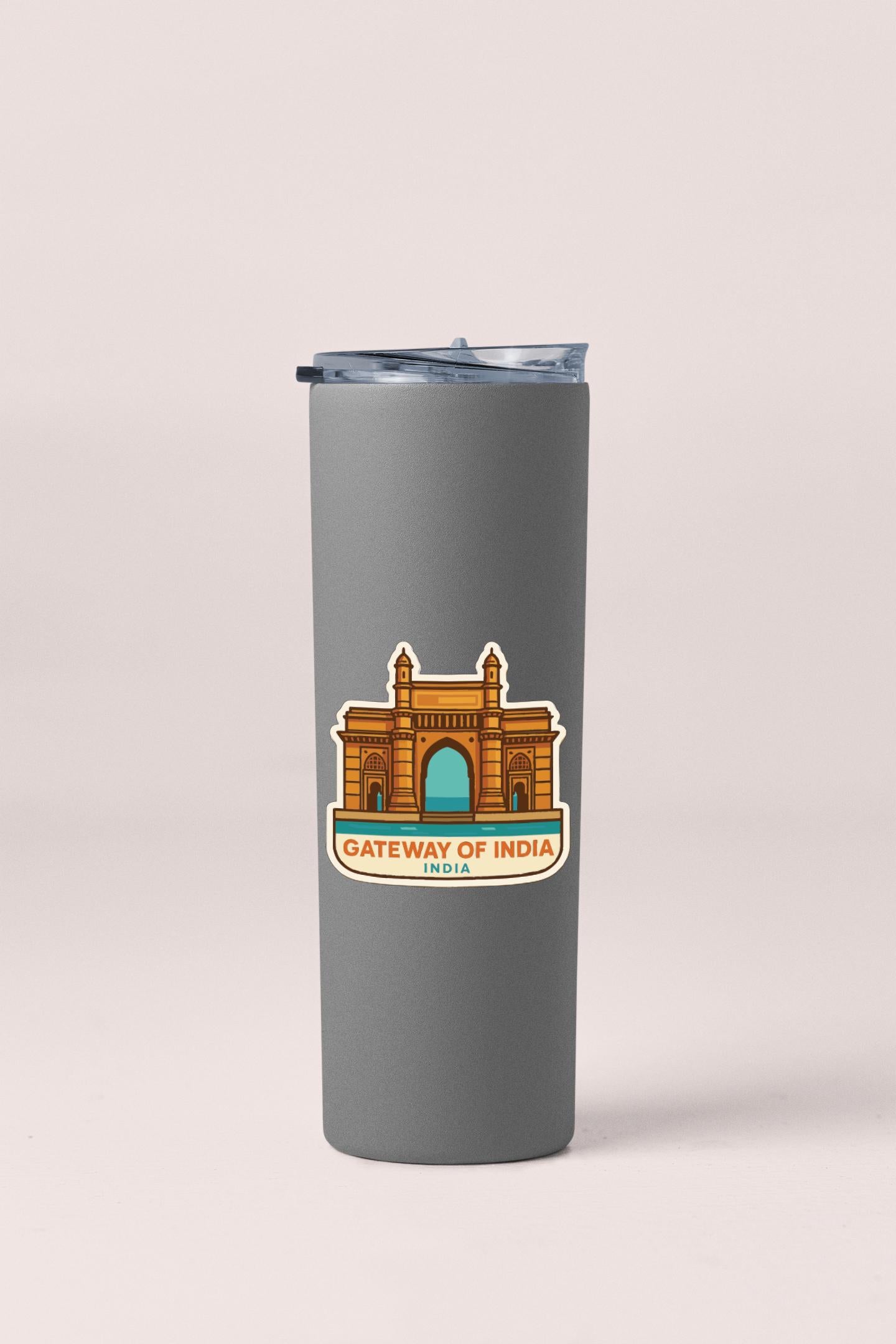 A gray tumbler with a sticker depicting the Gateway of India, a famous landmark in India.