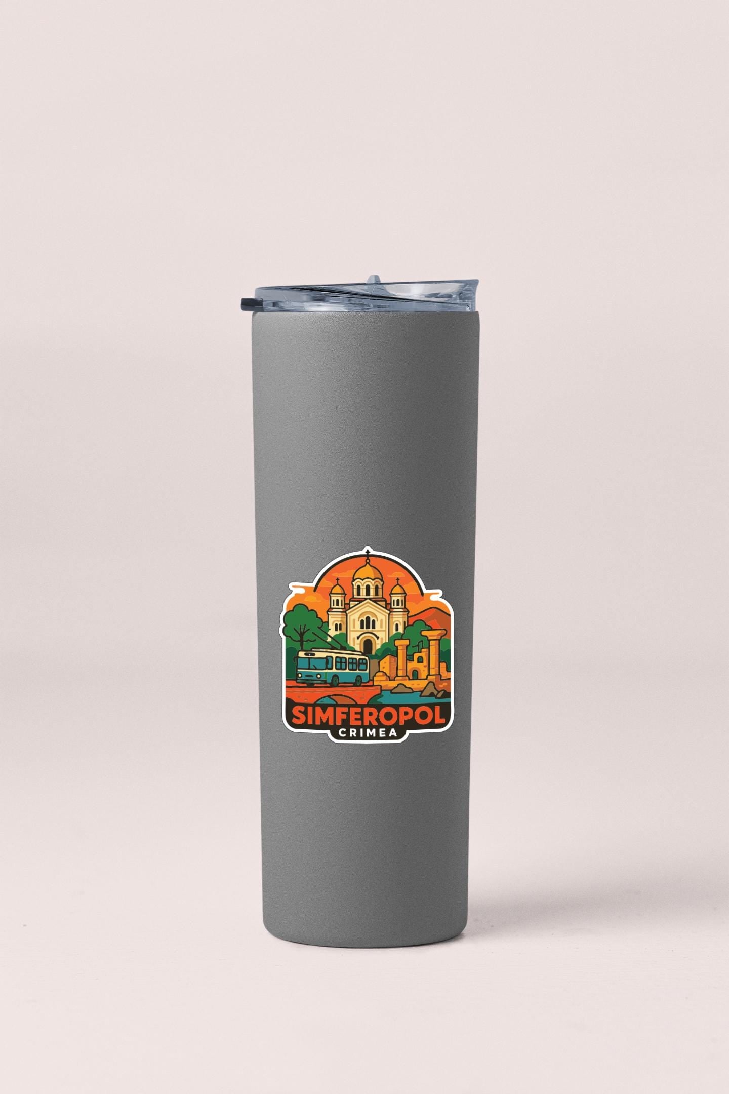 A gray insulated tumbler with a printed sticker depicting a cityscape and the text "SIMFEROPOL CRIMEA".
