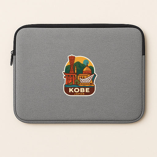A gray laptop sleeve with a sticker of the famous landmark, the Tokyo Dome, prominently displayed on it.