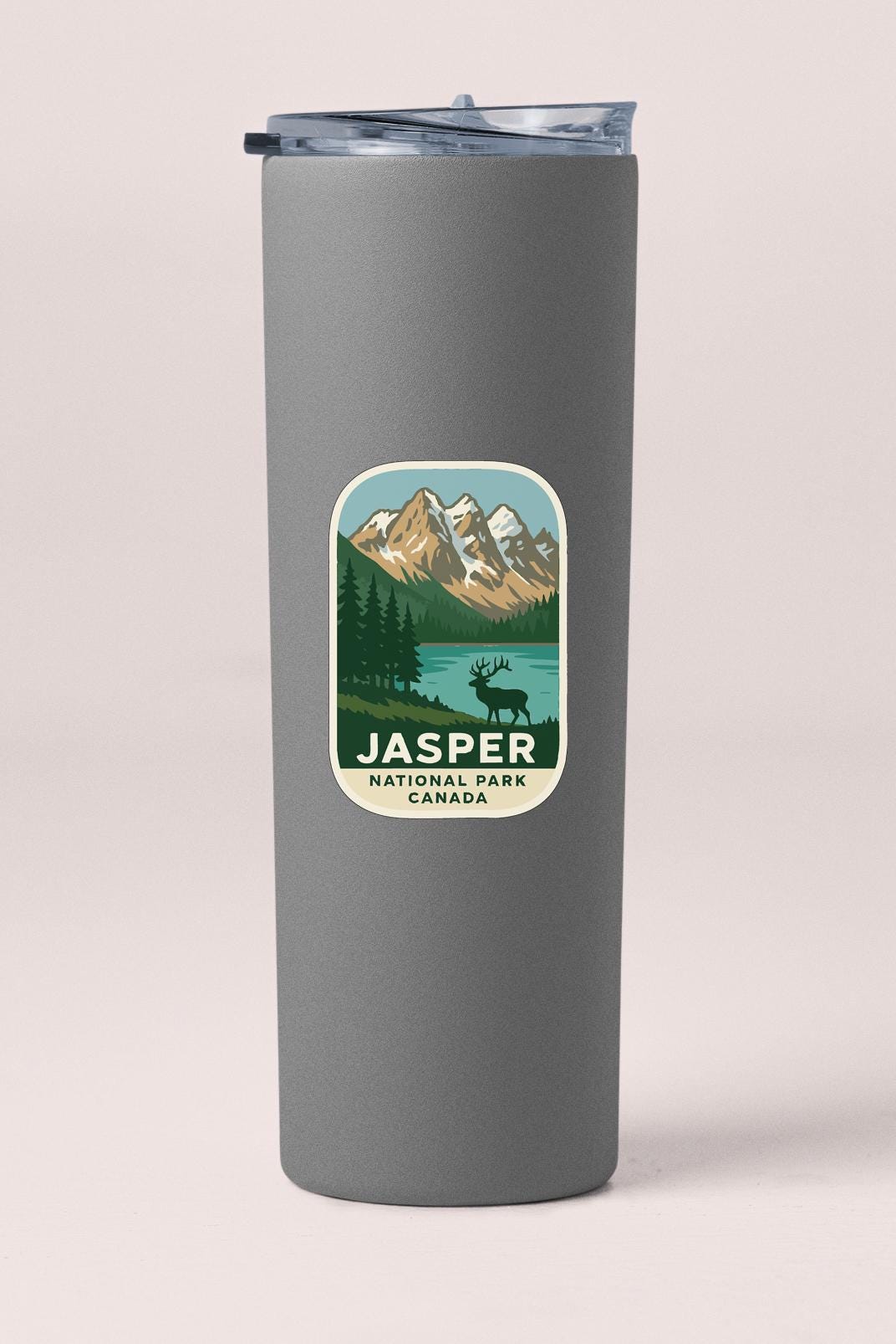 A gray cylindrical container with a label that features an illustration of a mountain landscape and the text "JASPER NATIONAL PARK CANADA".