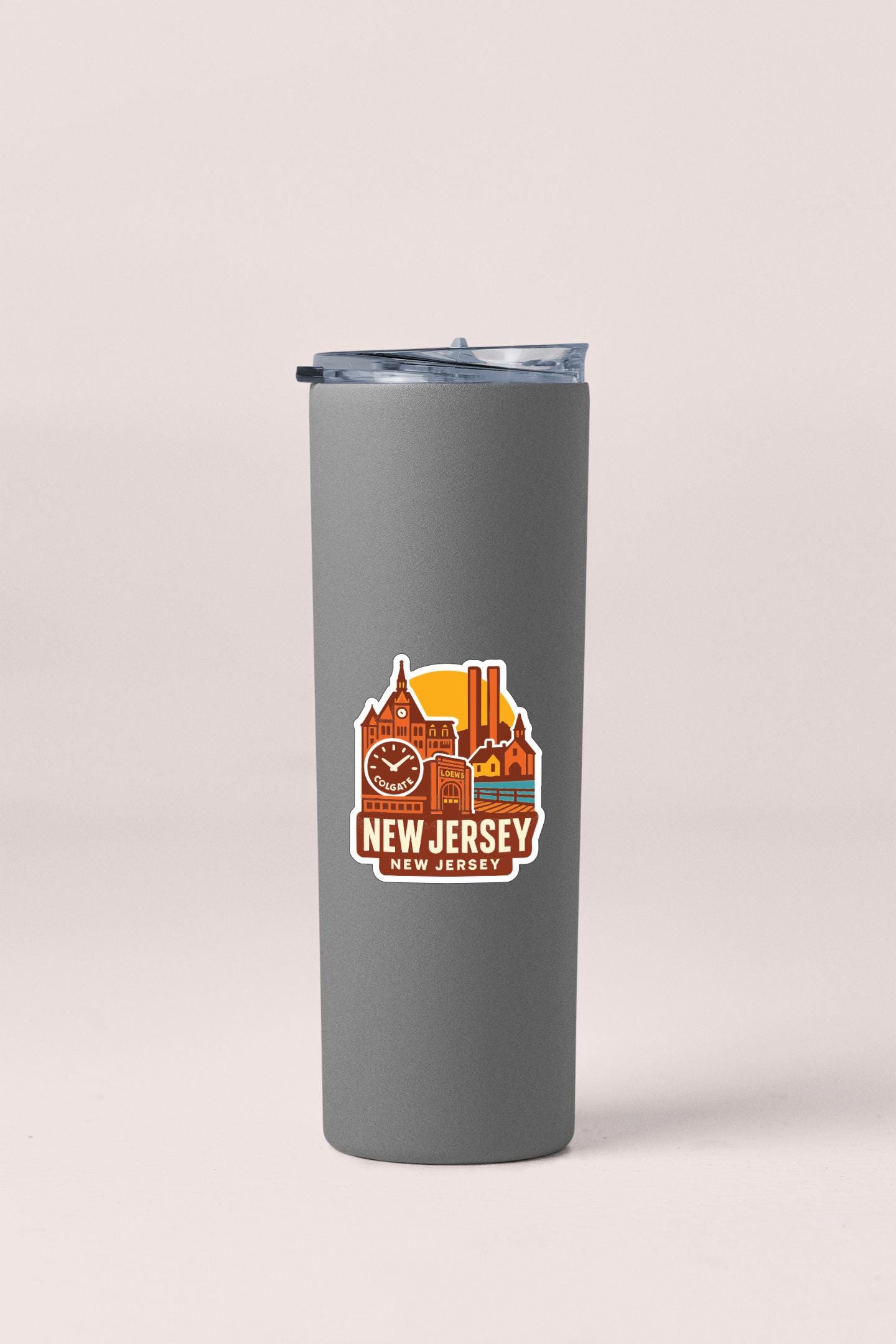 A gray insulated tumbler with a New Jersey state logo printed on it.