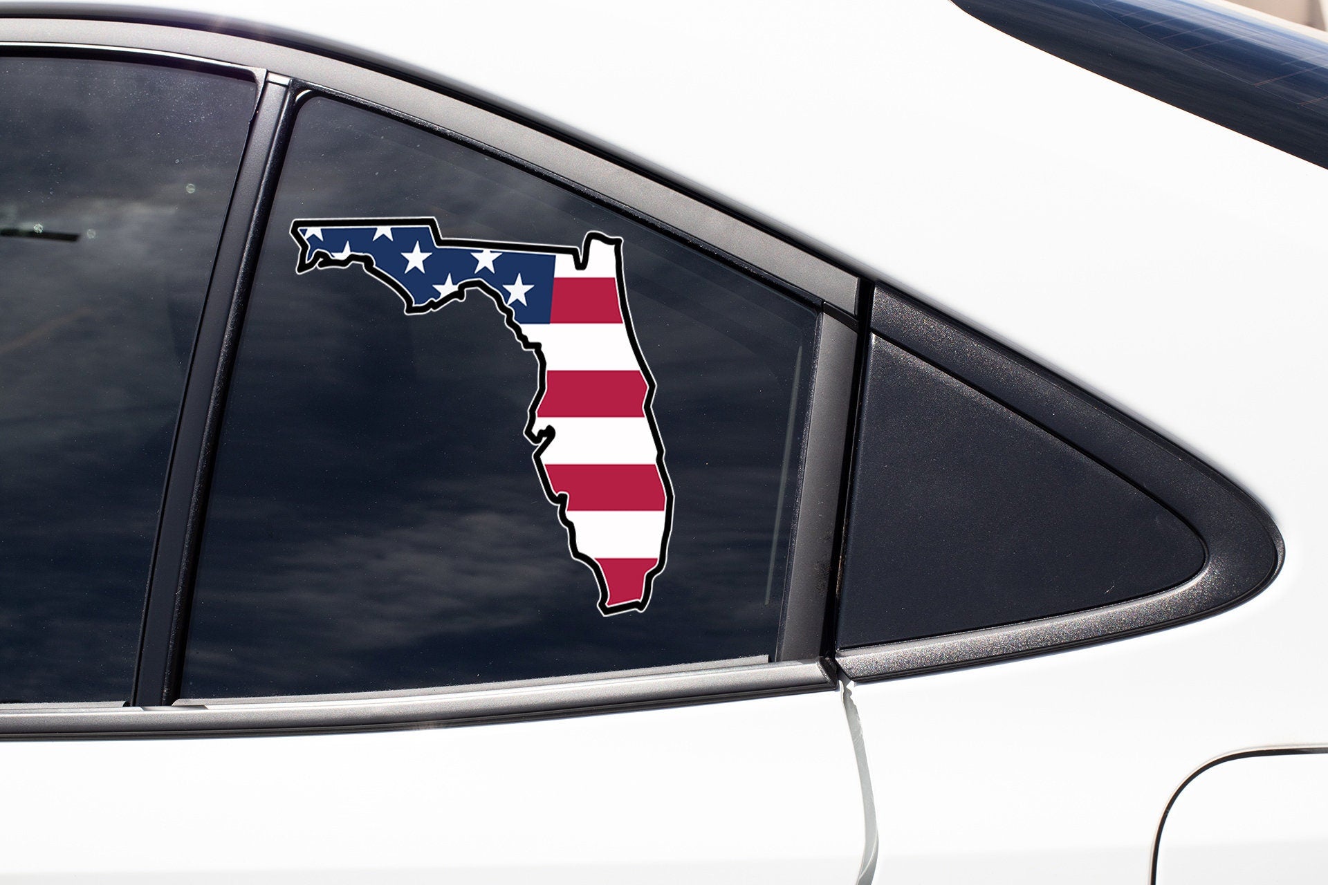 a car with a sticker of the state of florida