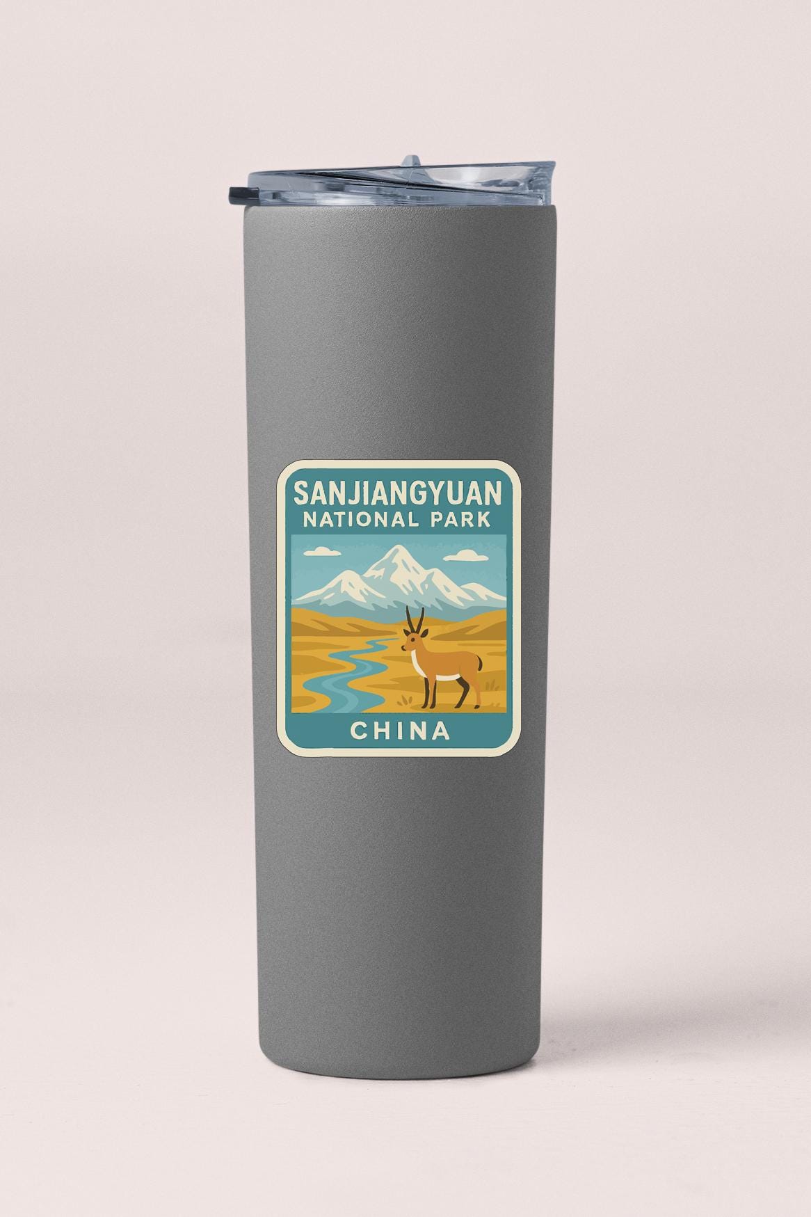 A gray insulated tumbler with a label that says "SANJIANGYUAN NATIONAL PARK CHINA".