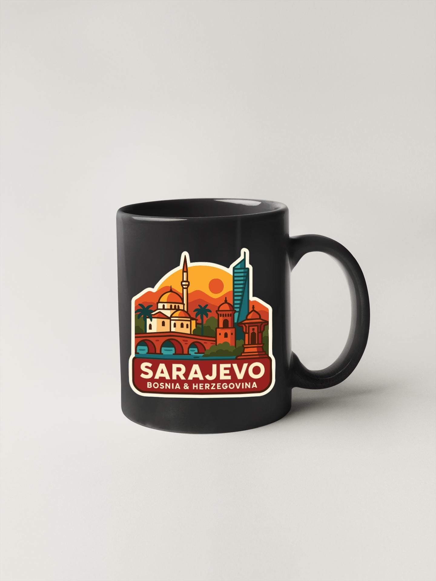 A black coffee mug with a colorful illustration of the cityscape of Sarajevo, Bosnia and Herzegovina.