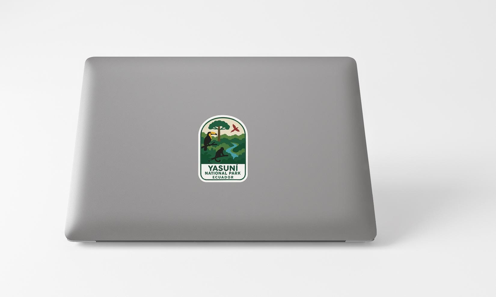 a sticker with a landscape and a river on a laptop.