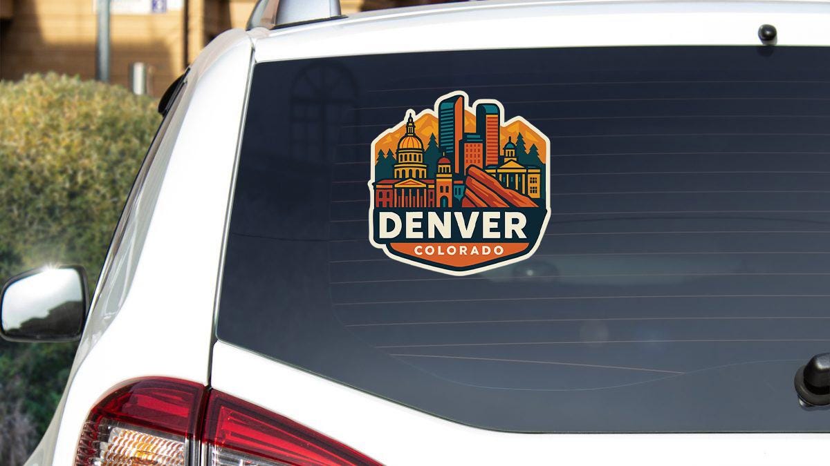 a sticker on the back of a car that says denver