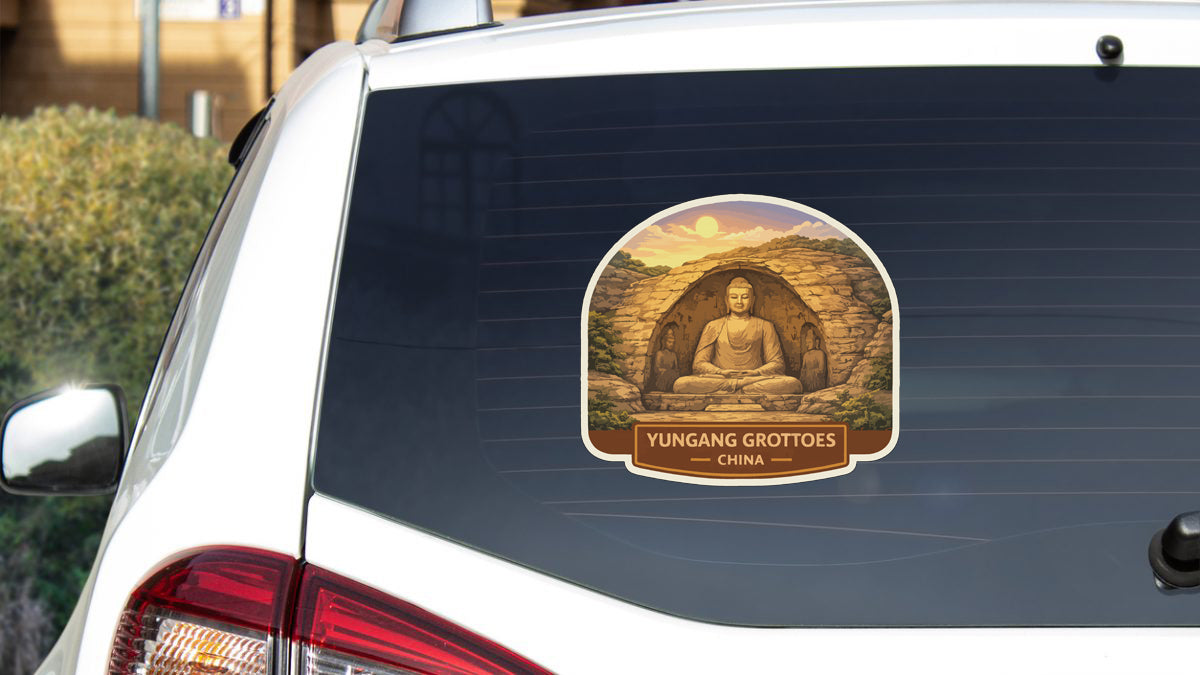 a sticker on the rear window of a car, depicting a Buddha statue.