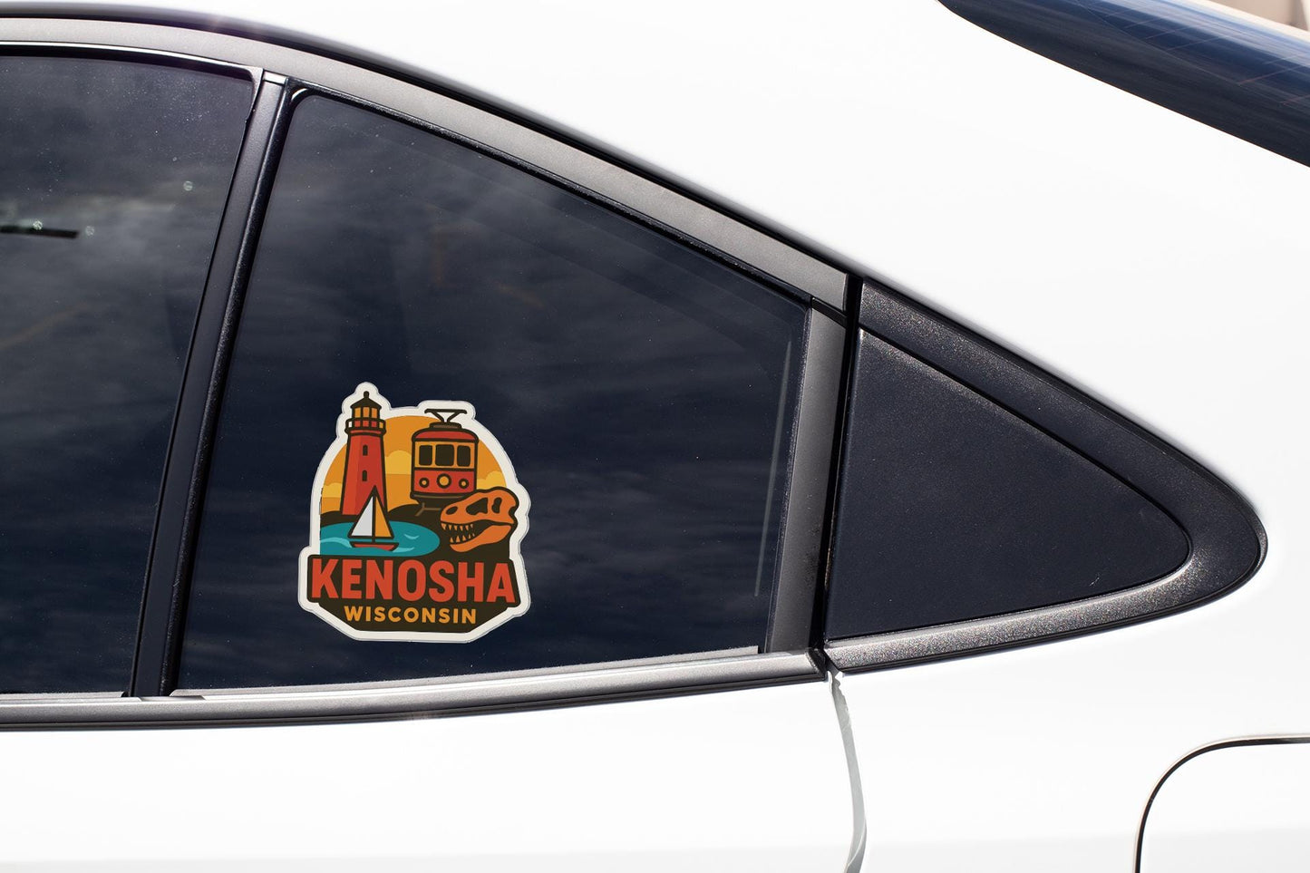 A sticker on the side of a car window, depicting a lighthouse and a train, with the text "KENOSHA WISCONSIN".